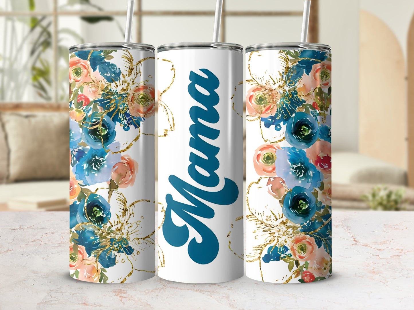 White tumbler with "Mama" in blue script surrounded by floral and gold accents.