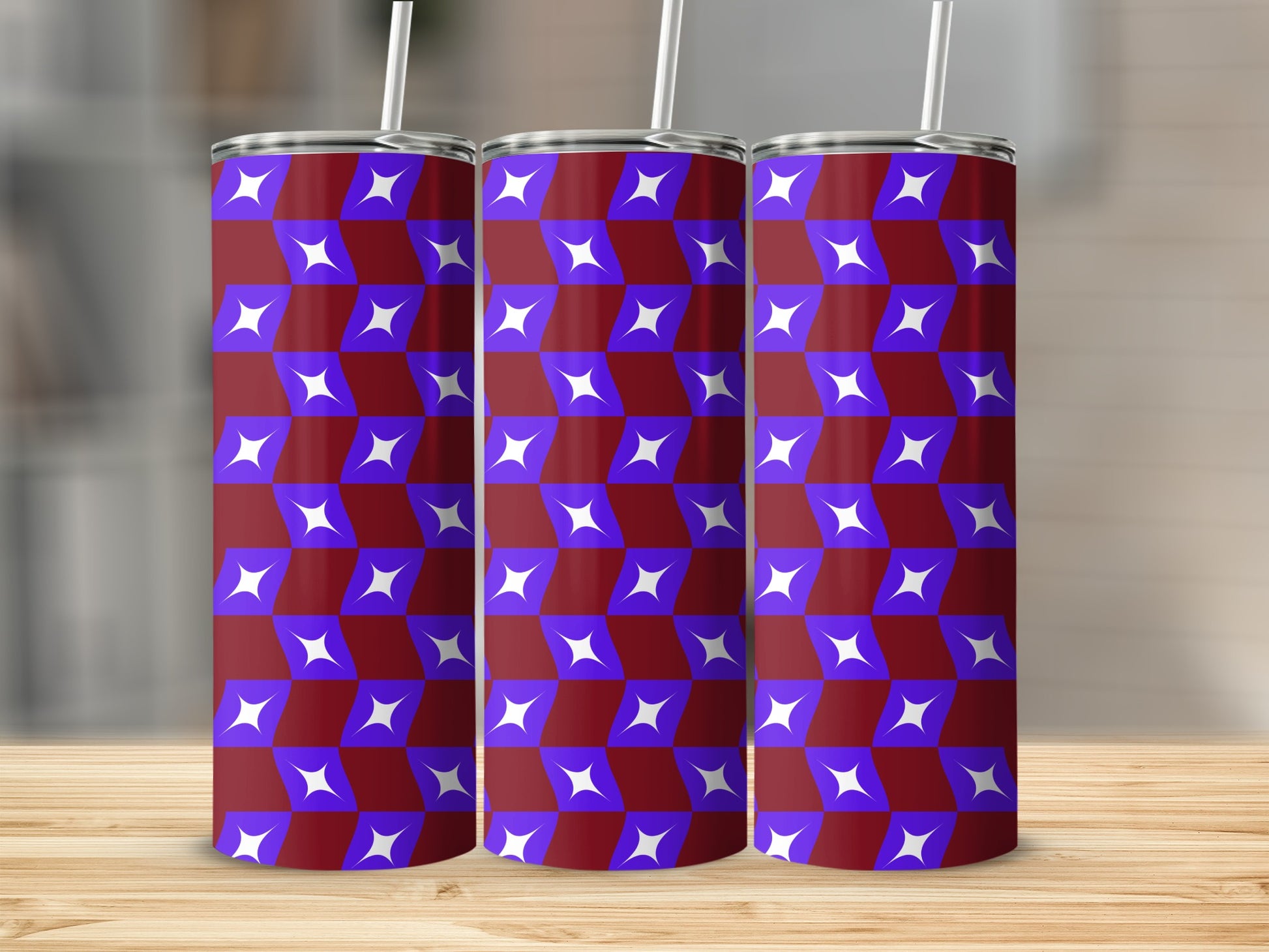 Three tumblers with a purple and blue starburst pattern on a wooden surface.
