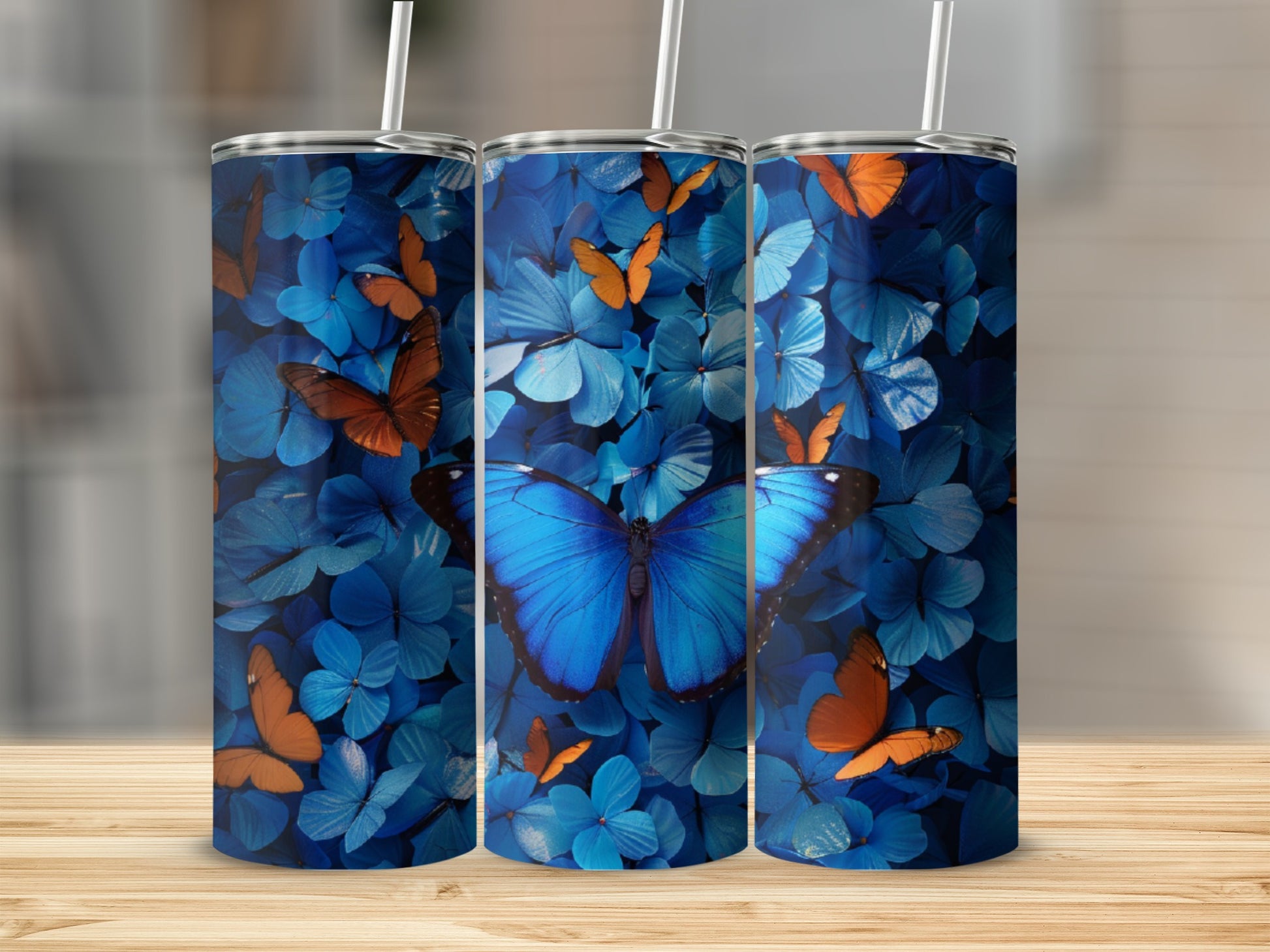 Blue butterfly pattern on a set of three tumblers.