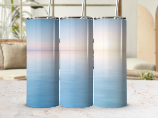 Three tumblers with serene ocean sunset design.
