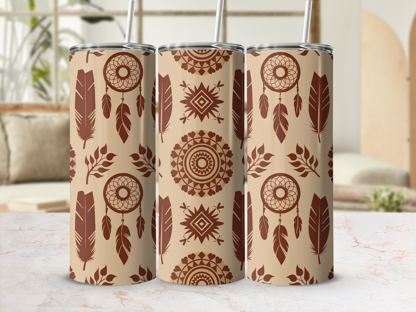 Three tan tumblers with dreamcatcher and feather pattern.