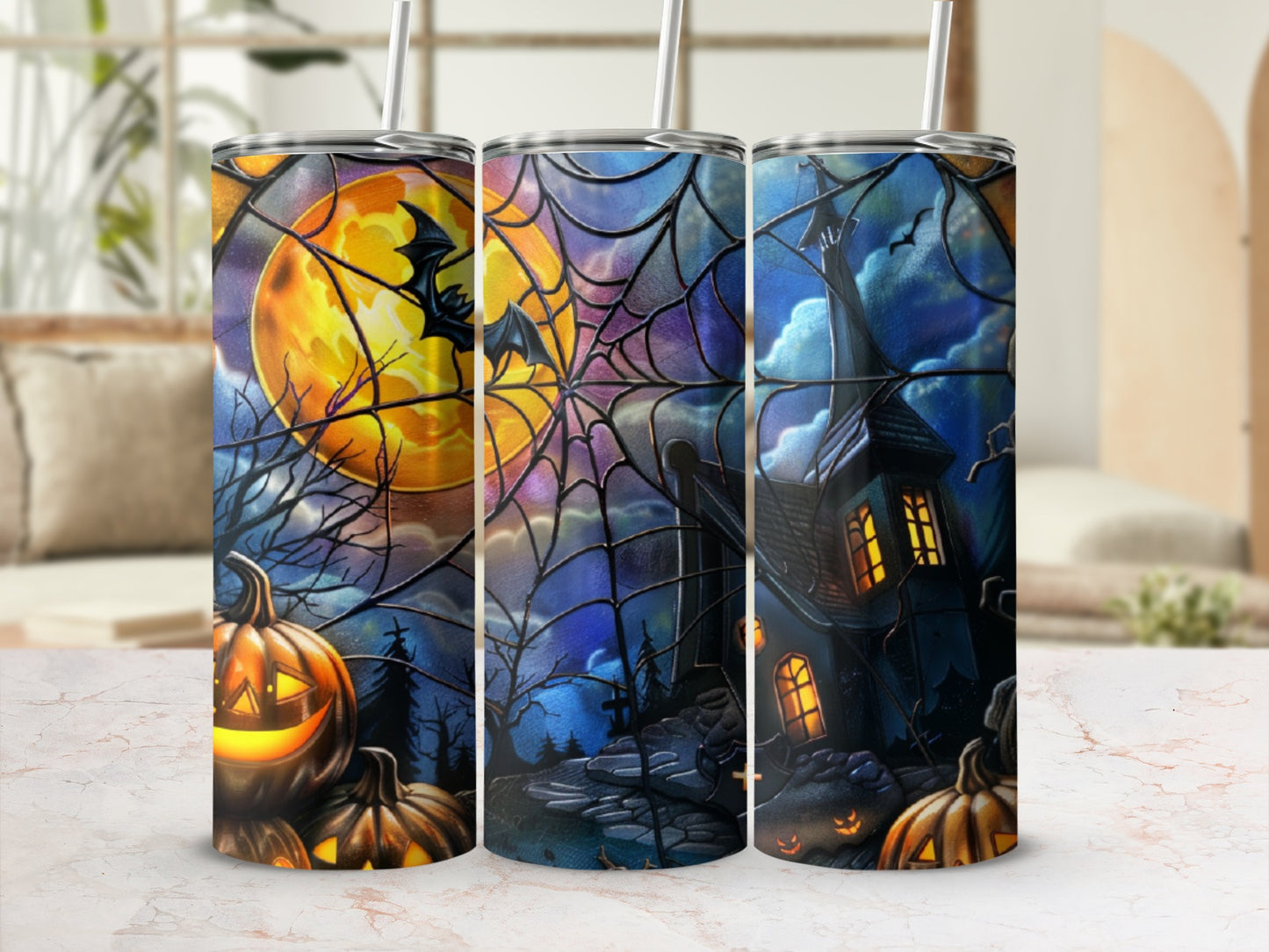 Halloween tumbler with spooky house, pumpkins, bats, and spiderweb.