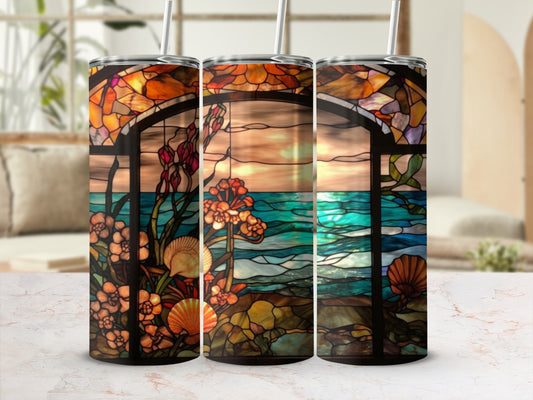 Stained glass tumbler with floral and ocean sunset scene.