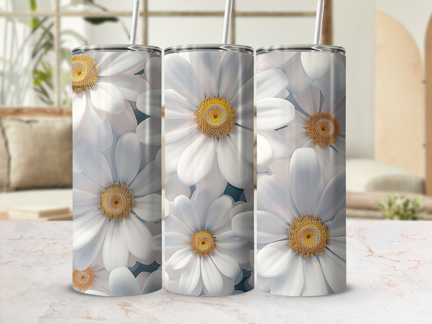 Three tumblers adorned with large white daisies and yellow centers.