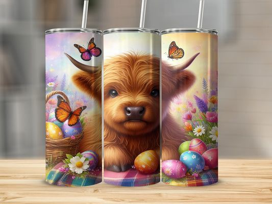 Three colorful tumblers feature a Highland cow surrounded by Easter eggs and butterflies.