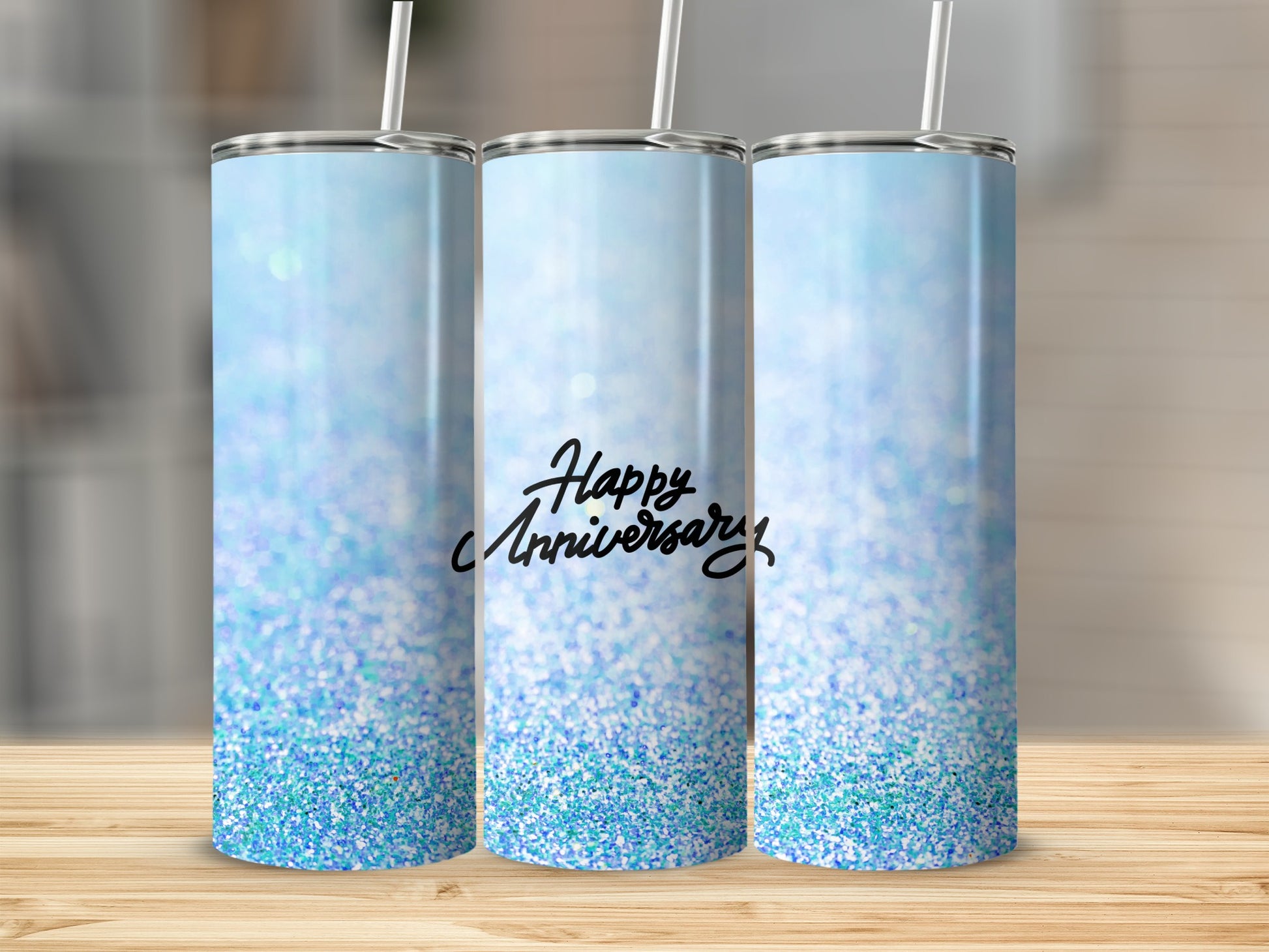 Blue glitter tumbler with "Happy Anniversary" text.