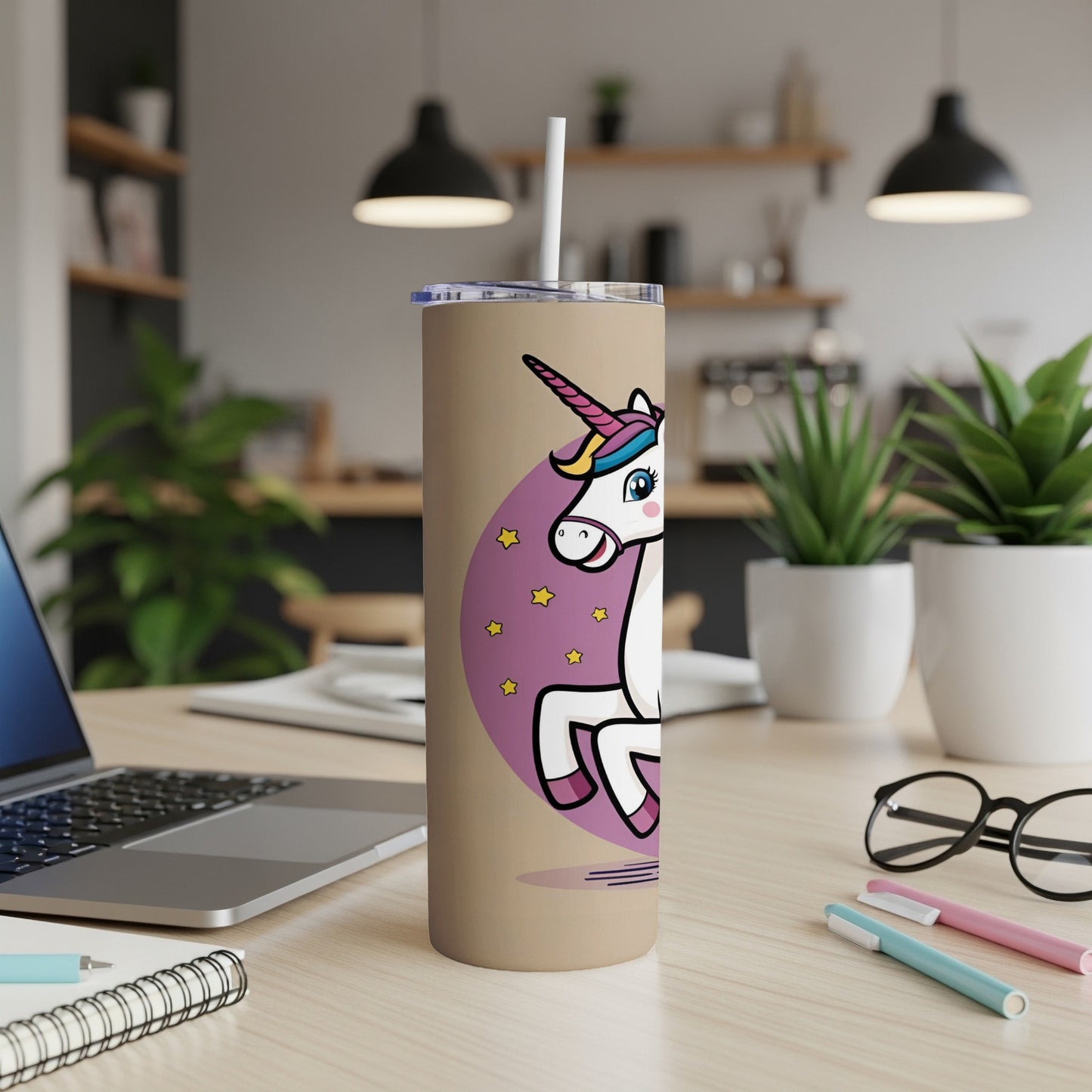 Tan tumbler with a cartoon unicorn and stars.