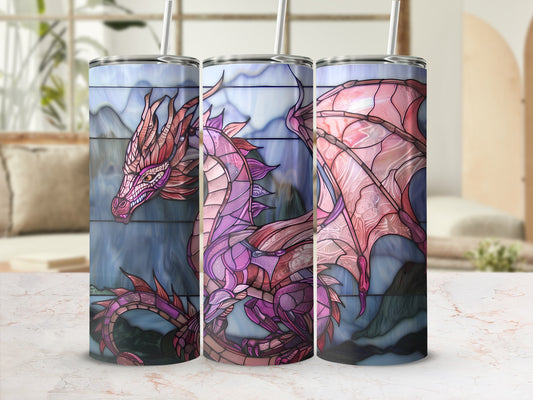Dragon art on three tumblers with mountain background.