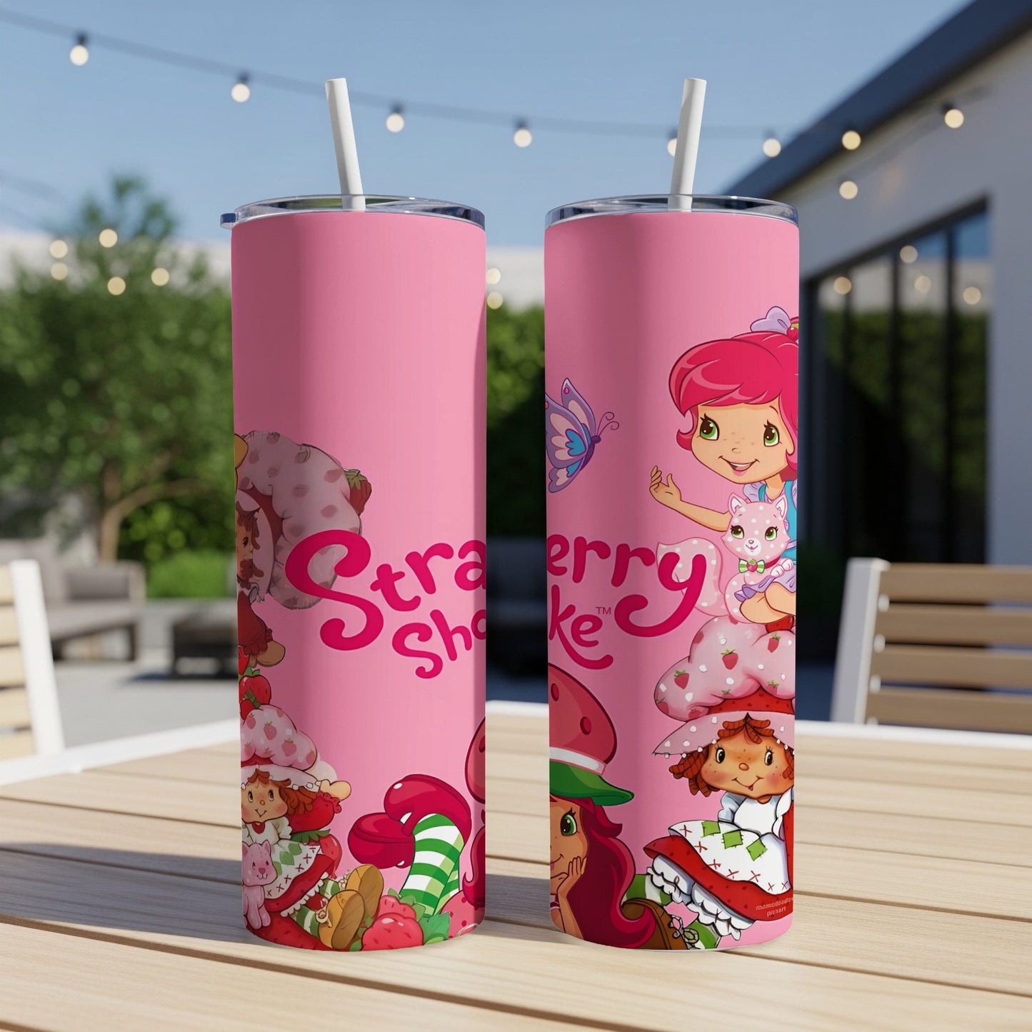 Two pink tumblers featuring Strawberry Shortcake and friends.