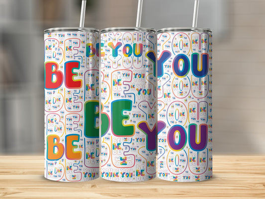 Three tumblers with colorful "BE YOU" text pattern.