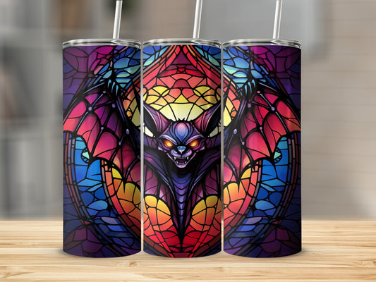 Stained glass tumbler with a vampire bat design.