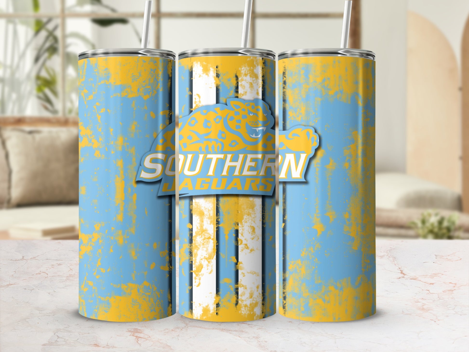 Tumblers with a distressed sky blue and yellow design and "Southern Jaguars" logo.