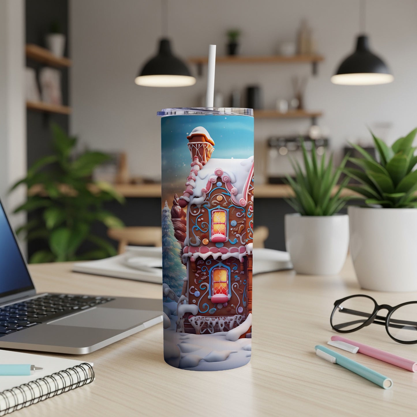Gingerbread house design on a tall, skinny tumbler with a straw.