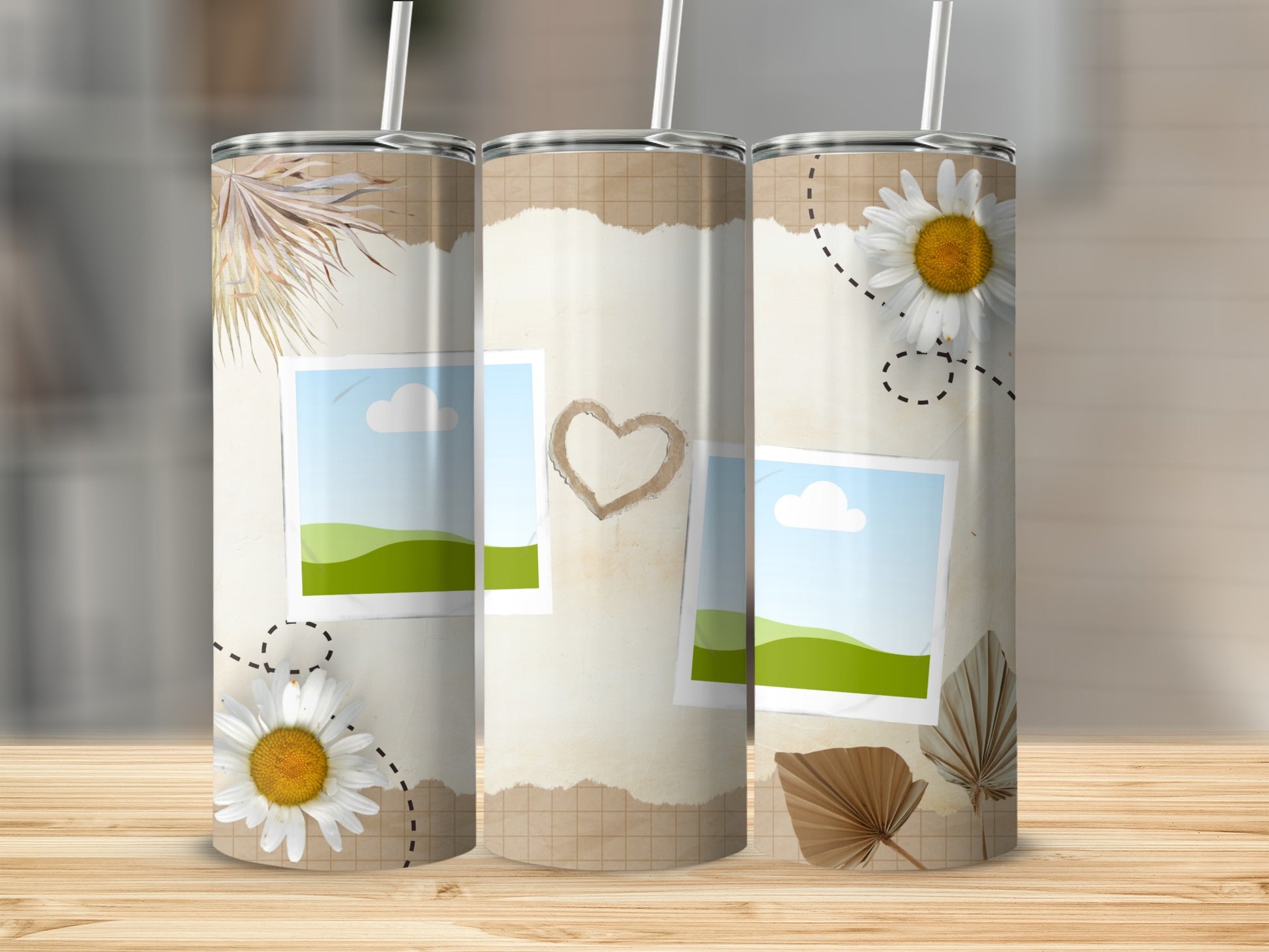 Three tumblers with a torn paper, photo, and daisy design.
