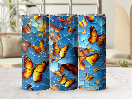 Blue tumbler with orange and yellow butterflies and honeycomb pattern.