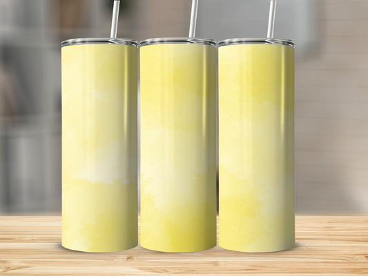 Three yellow watercolor tumblers on a wooden surface.