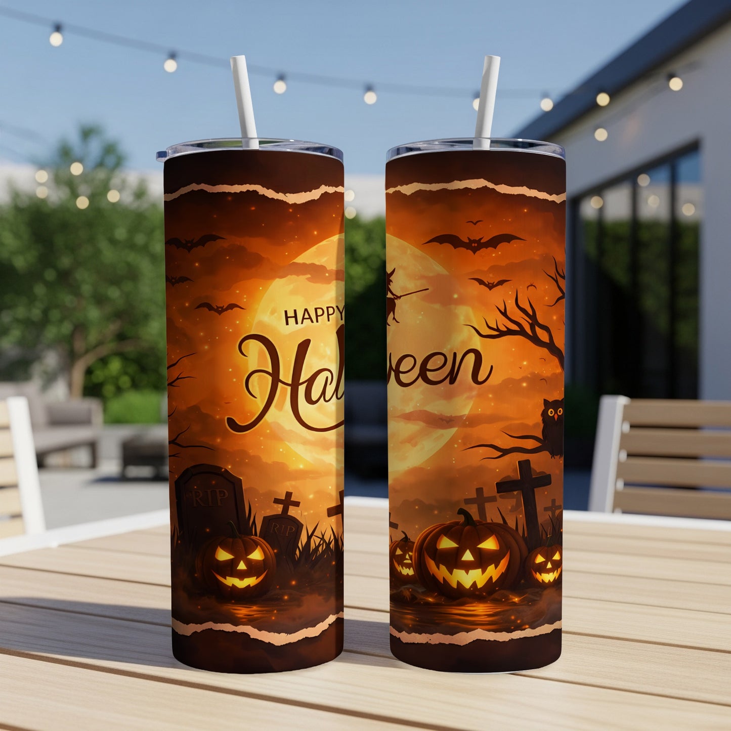 Two Halloween-themed tumblers with pumpkins, bats, and a graveyard scene.