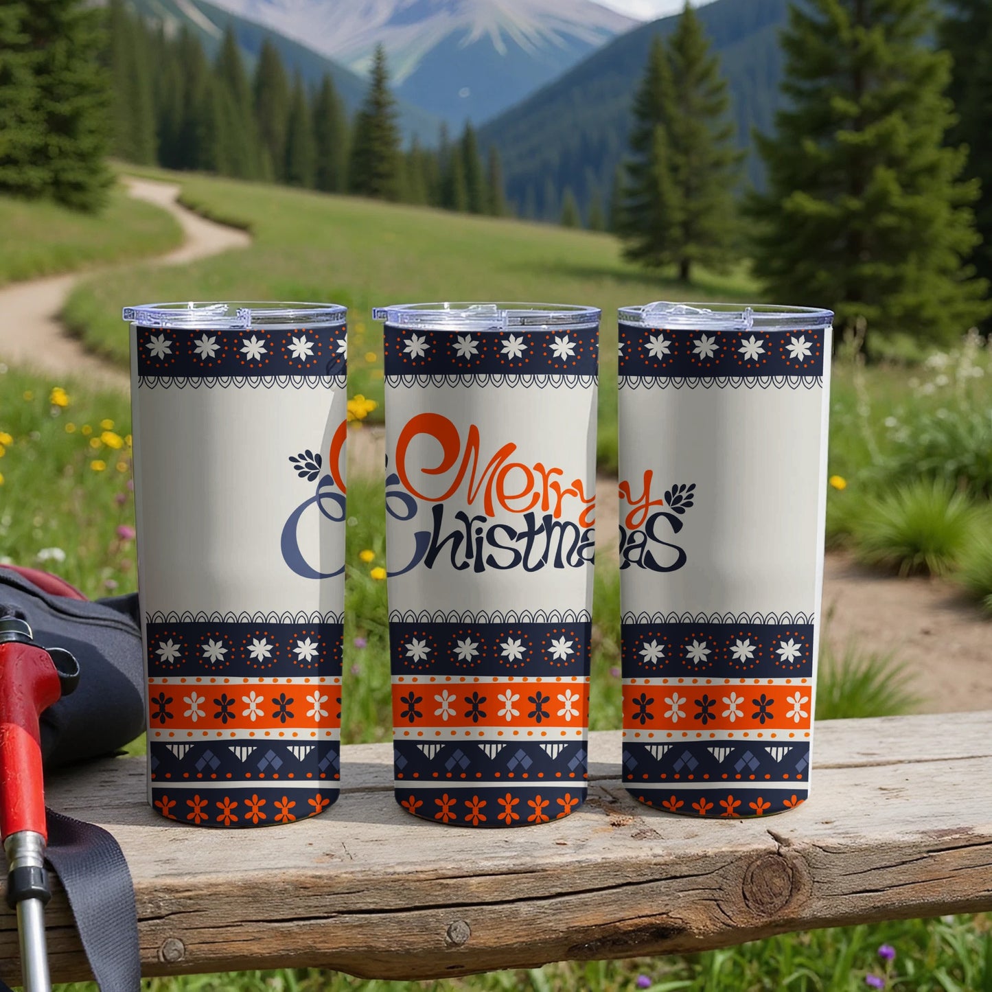 Three tumblers with "Merry Christmas" text and snowflake patterns.
