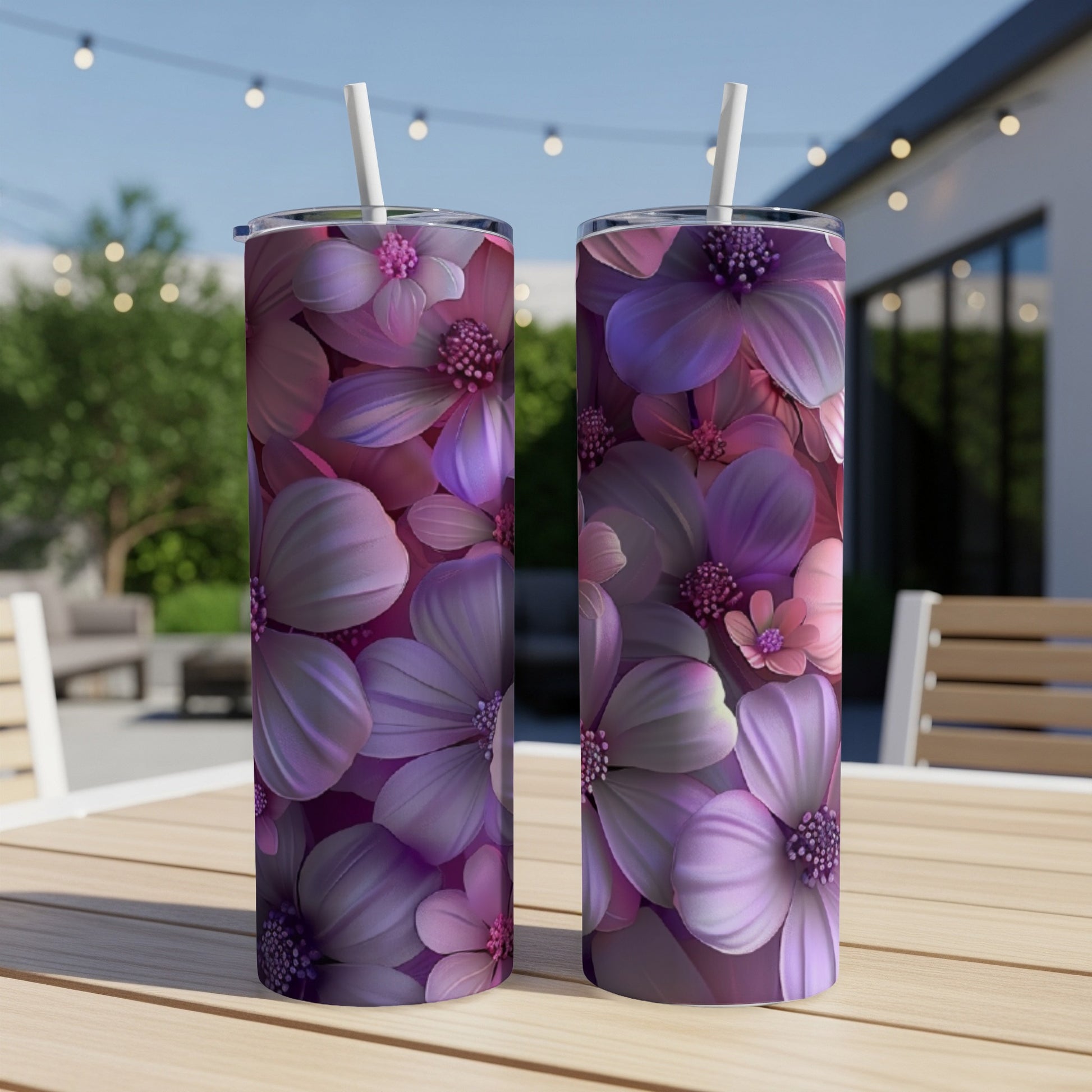Two tumblers with a floral design of purple and pink flowers.