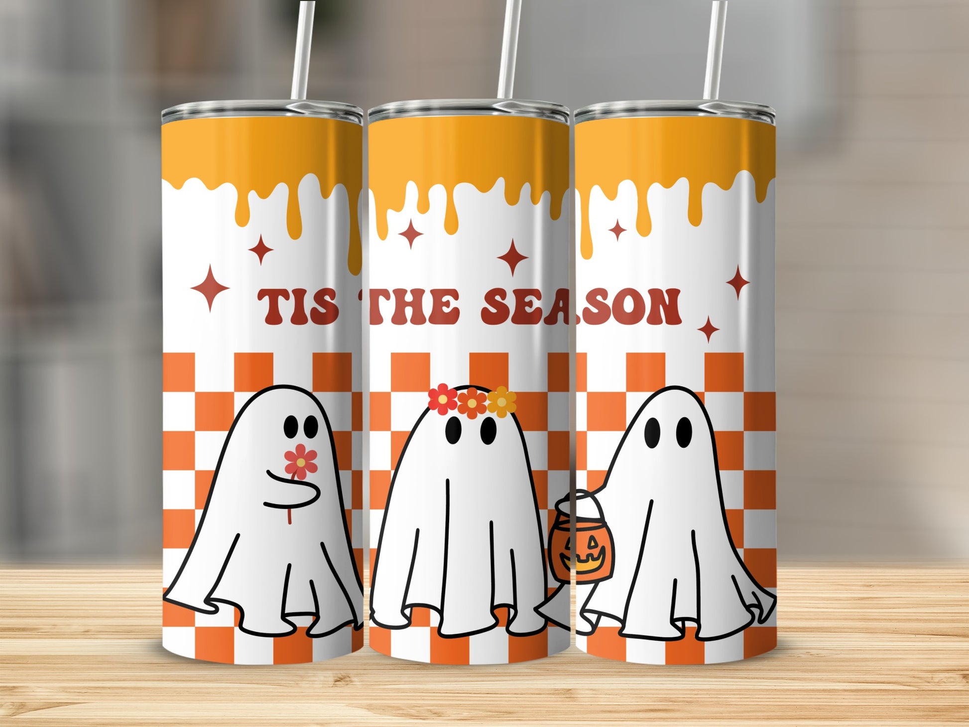 Three tumblers with a Halloween theme featuring ghosts, orange checkerboard, and "Tis the Season" text.
