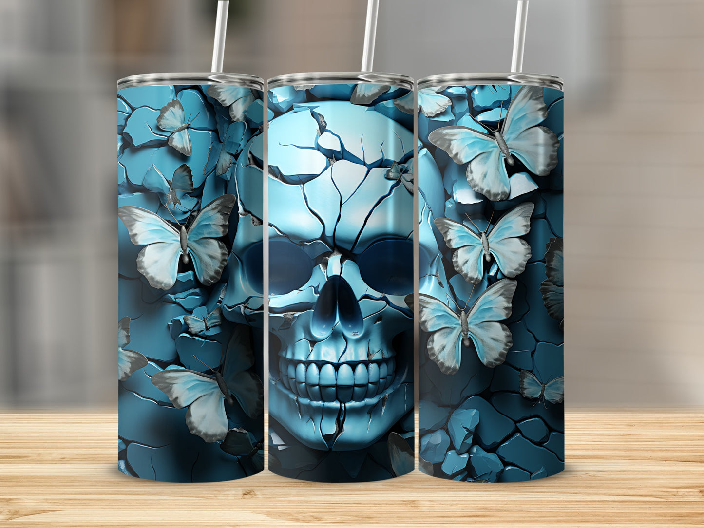 Blue cracked skull with butterflies, design on three tumblers.