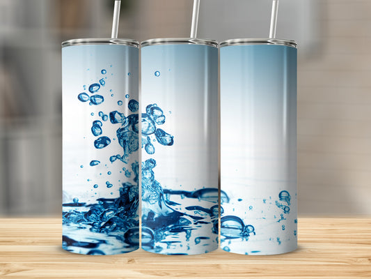 Three tumblers with splashes of water and bubbles.