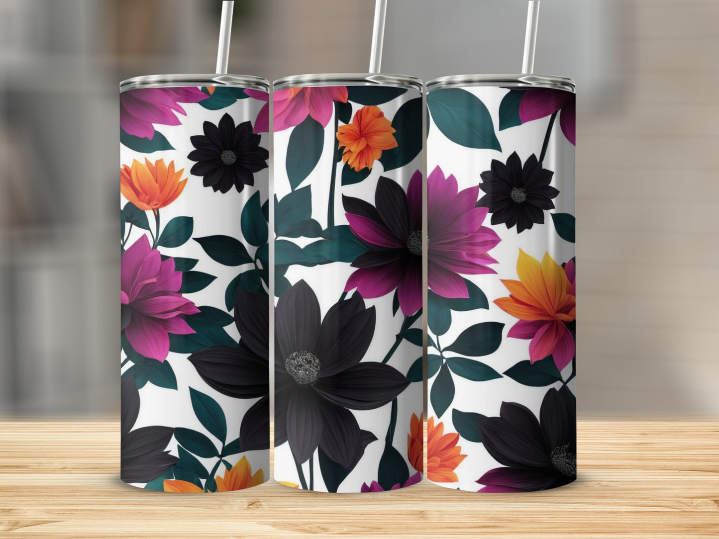Three tumblers with a dark floral pattern on a wooden surface.