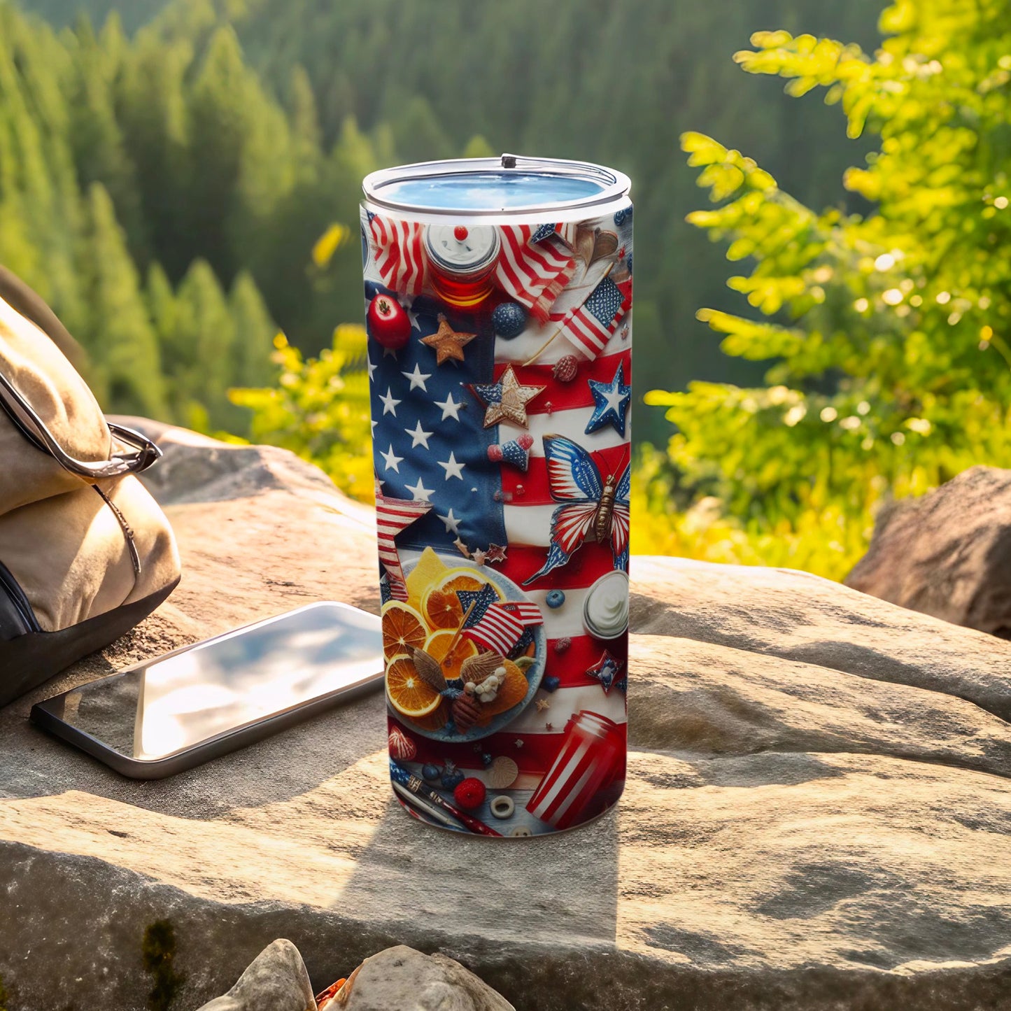 Patriotic tumbler with American flag, stars, berries, and nuts on a rock.
