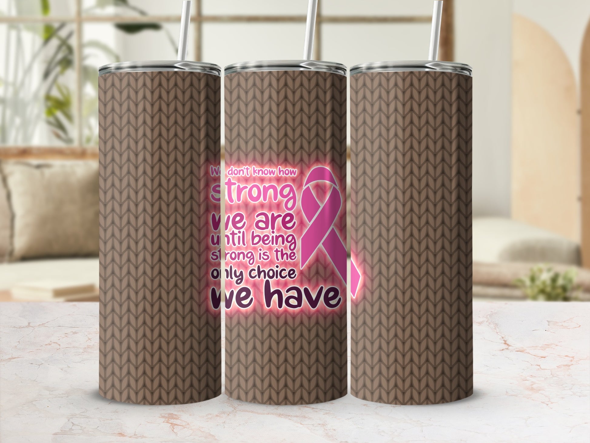 Three brown knit-patterned tumblers with pink ribbon and inspirational quote.