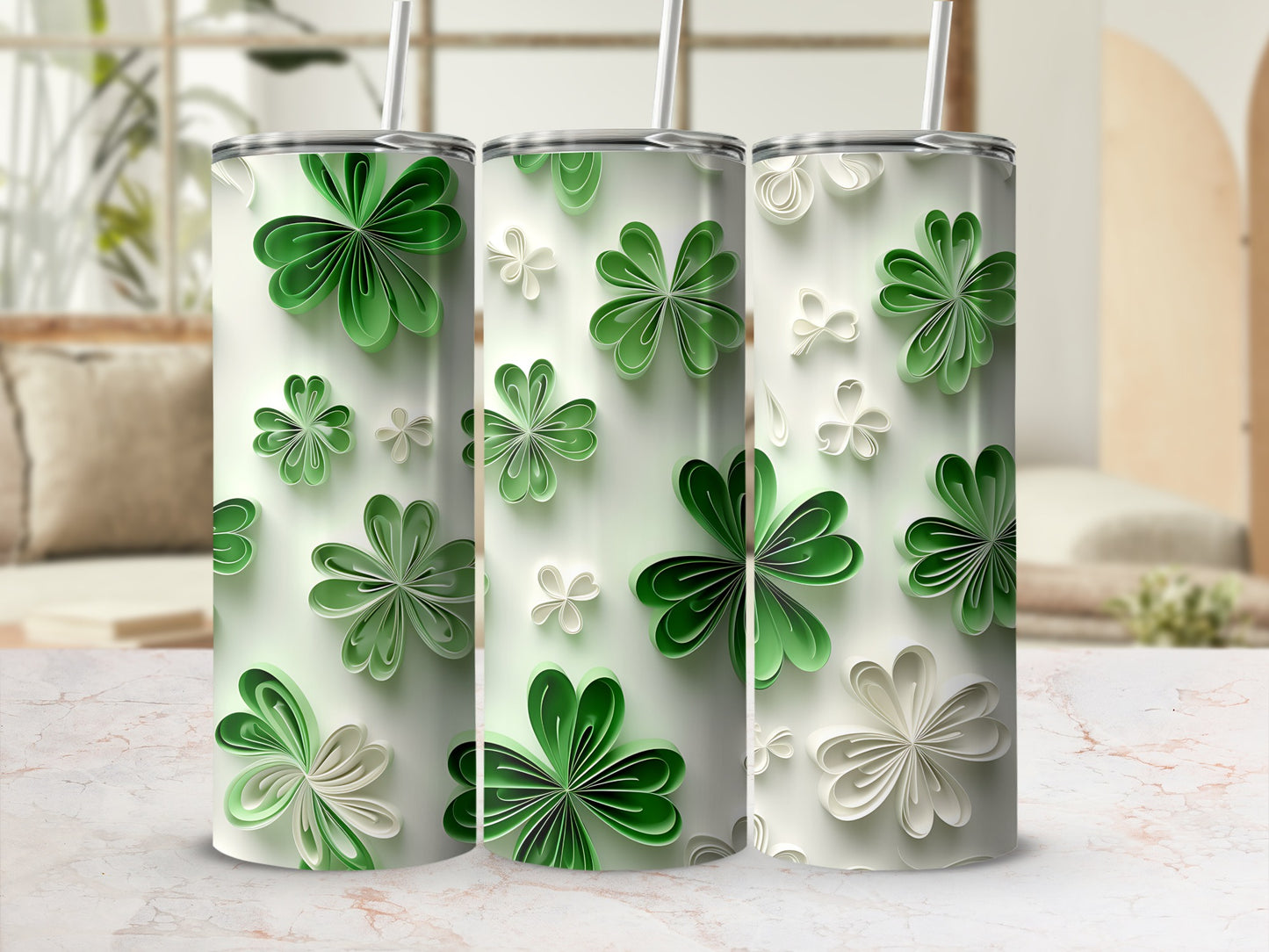 Three tumblers with a repeating green and white clover floral pattern.