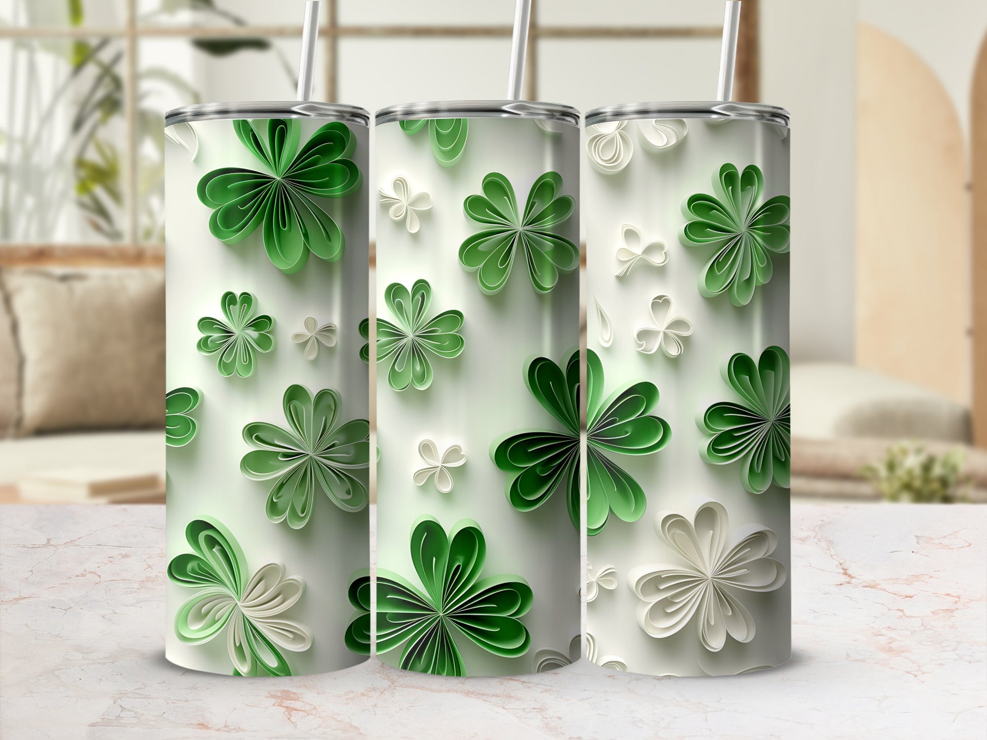 Three tumblers with a repeating green and white clover floral pattern.