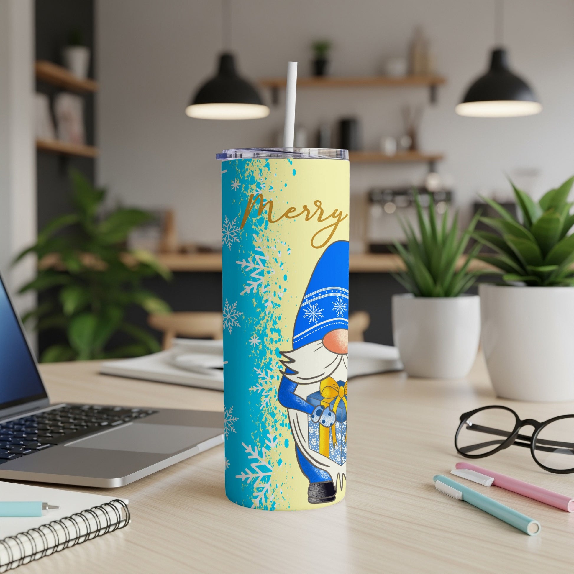 Yellow and blue tumbler with gnome and snowflakes, "Merry" text.