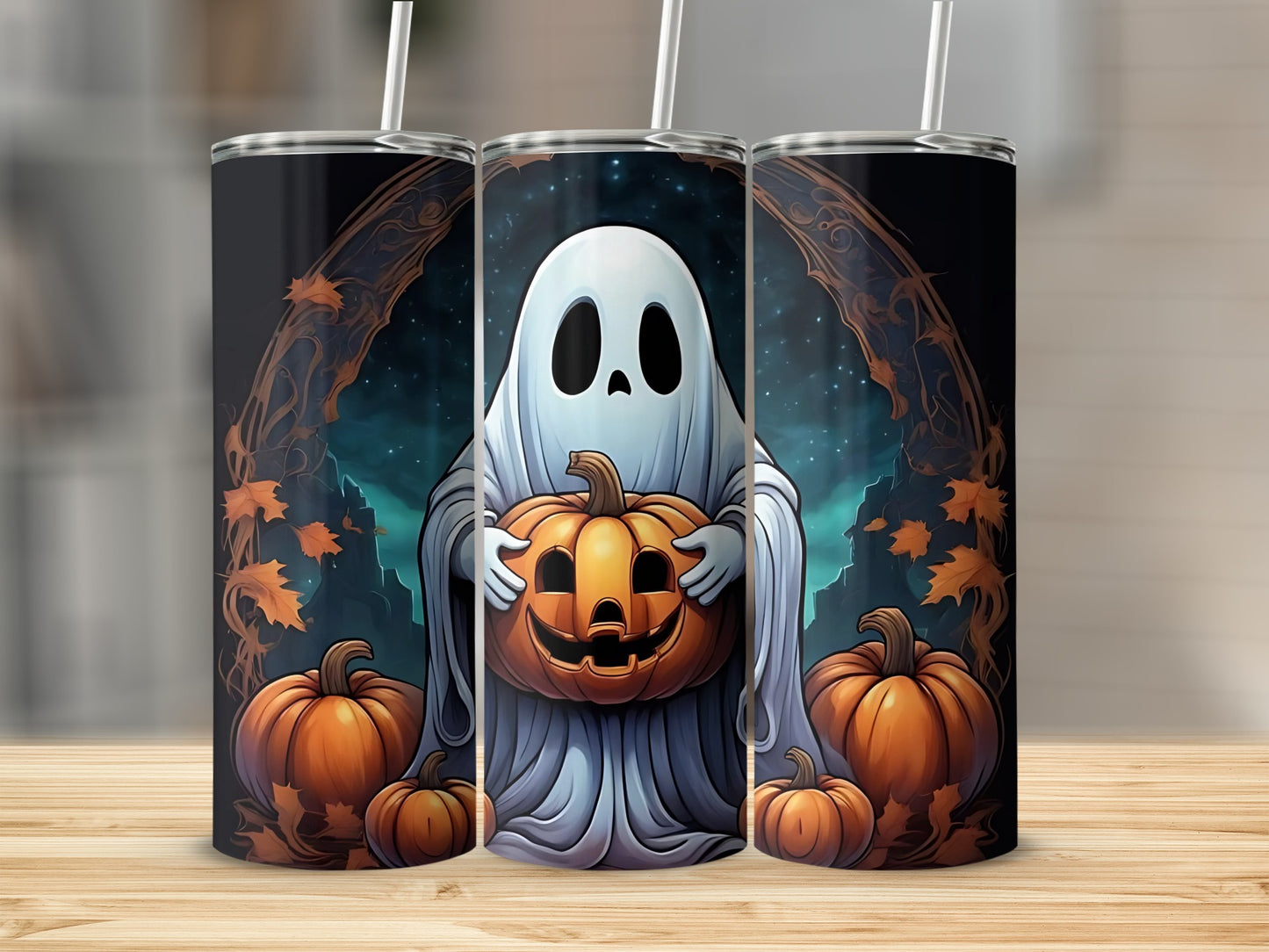 Three tumblers with a ghost holding a jack-o'-lantern and pumpkins.