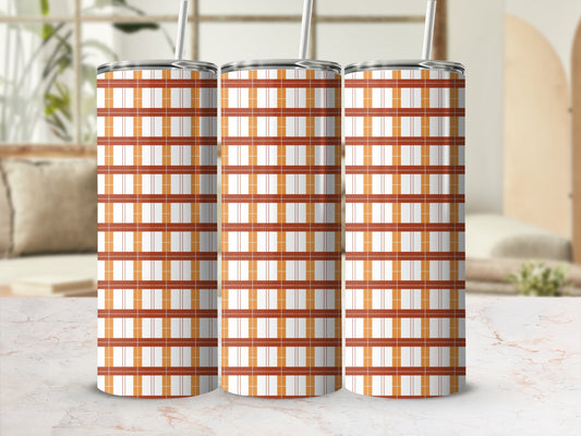 Three tumblers with orange and white plaid pattern and straw.