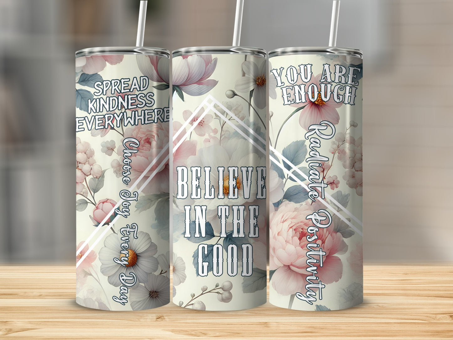 Floral tumbler with inspirational quotes "Believe in the Good" and "You Are Enough."