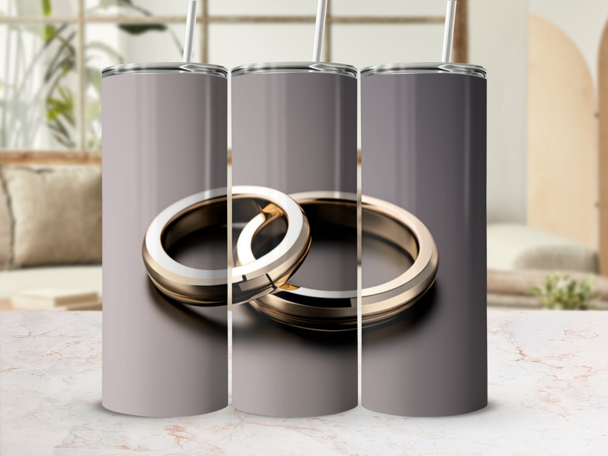 Three silver and gold wedding rings on a textured surface.