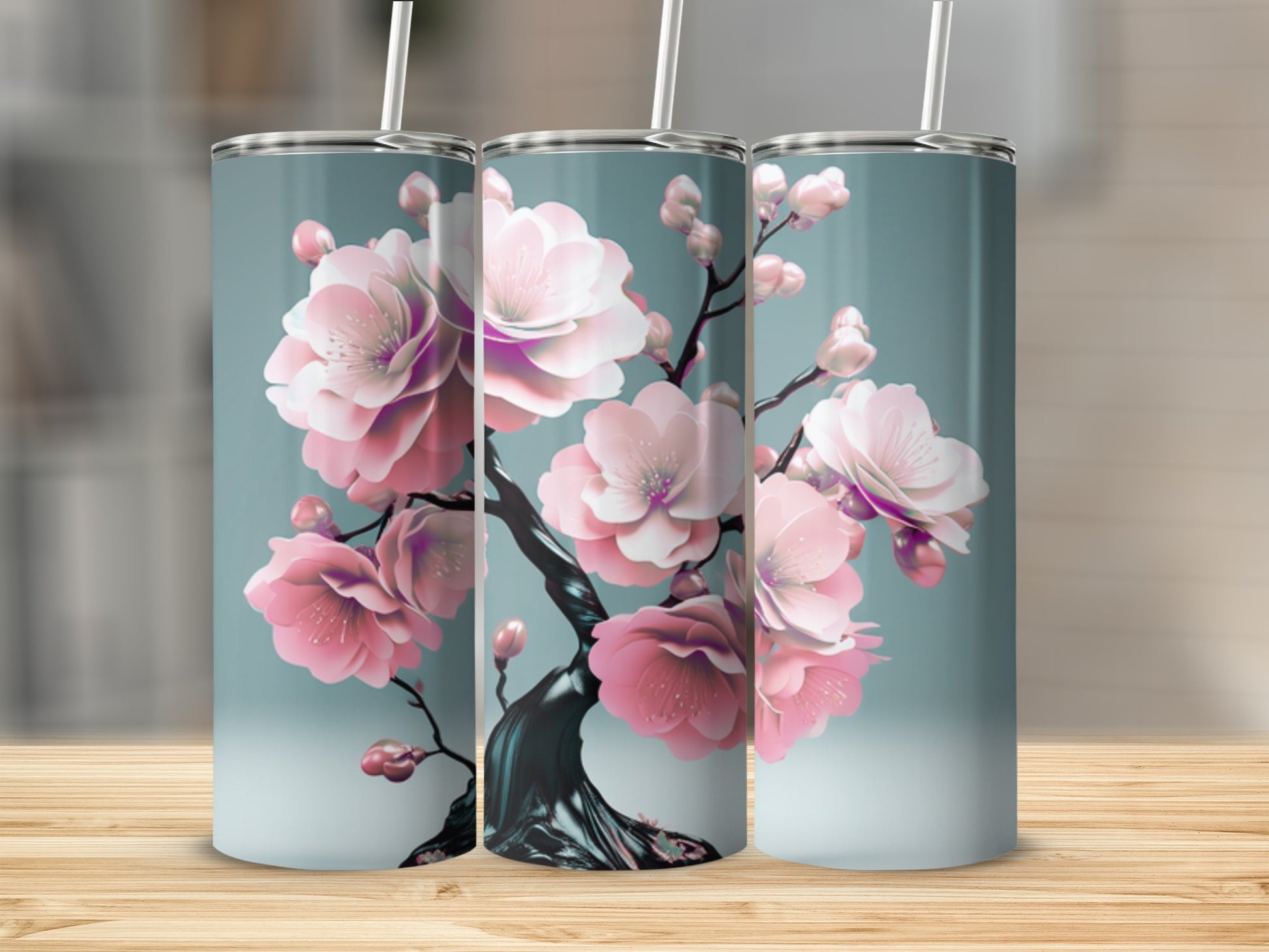 Three tumblers featuring pink cherry blossoms on a dark branch.