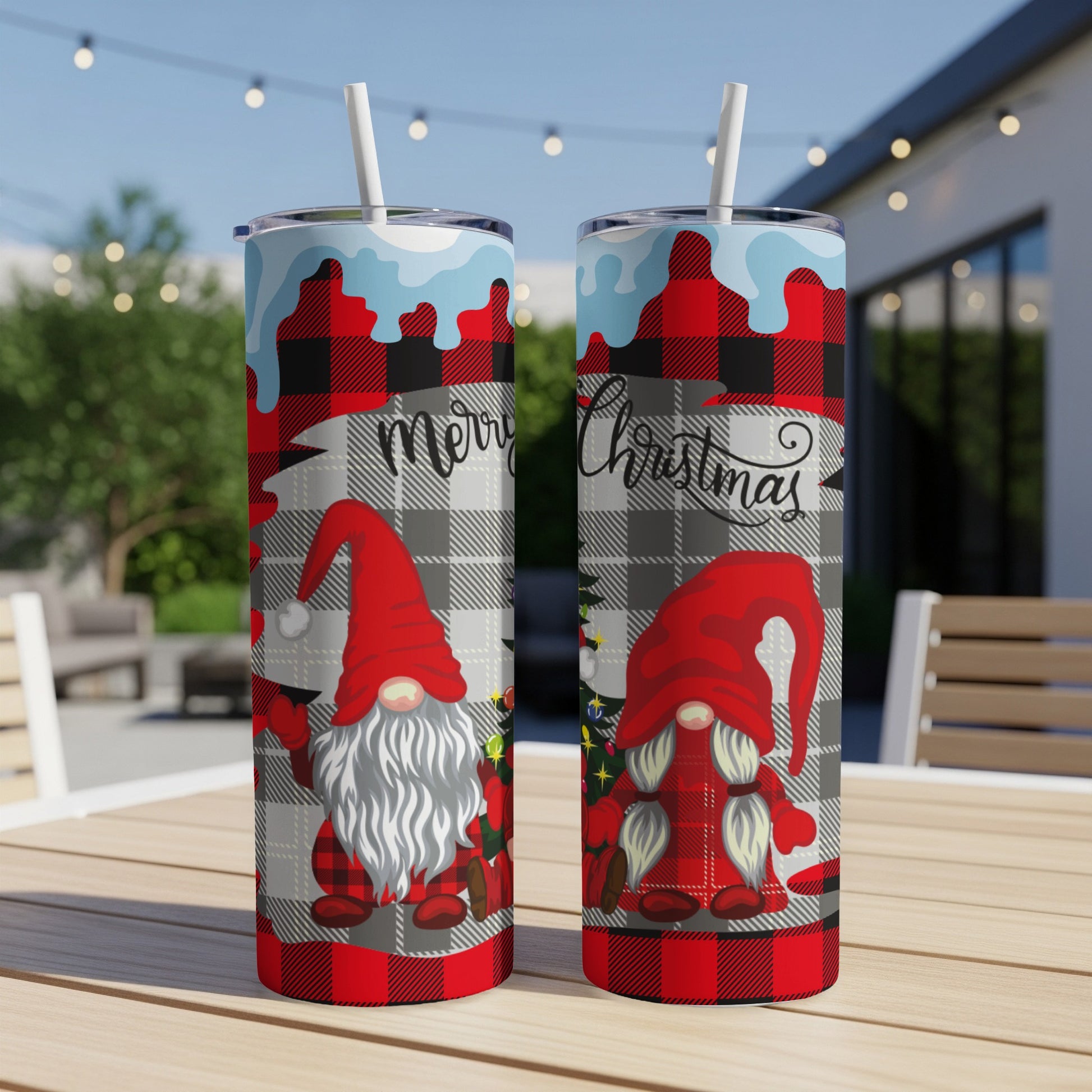 Two Christmas gnomes with plaid hats on a tumbler with "Merry Christmas" text.