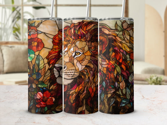 Lion with stained glass mane and flowers on a patterned tumbler.