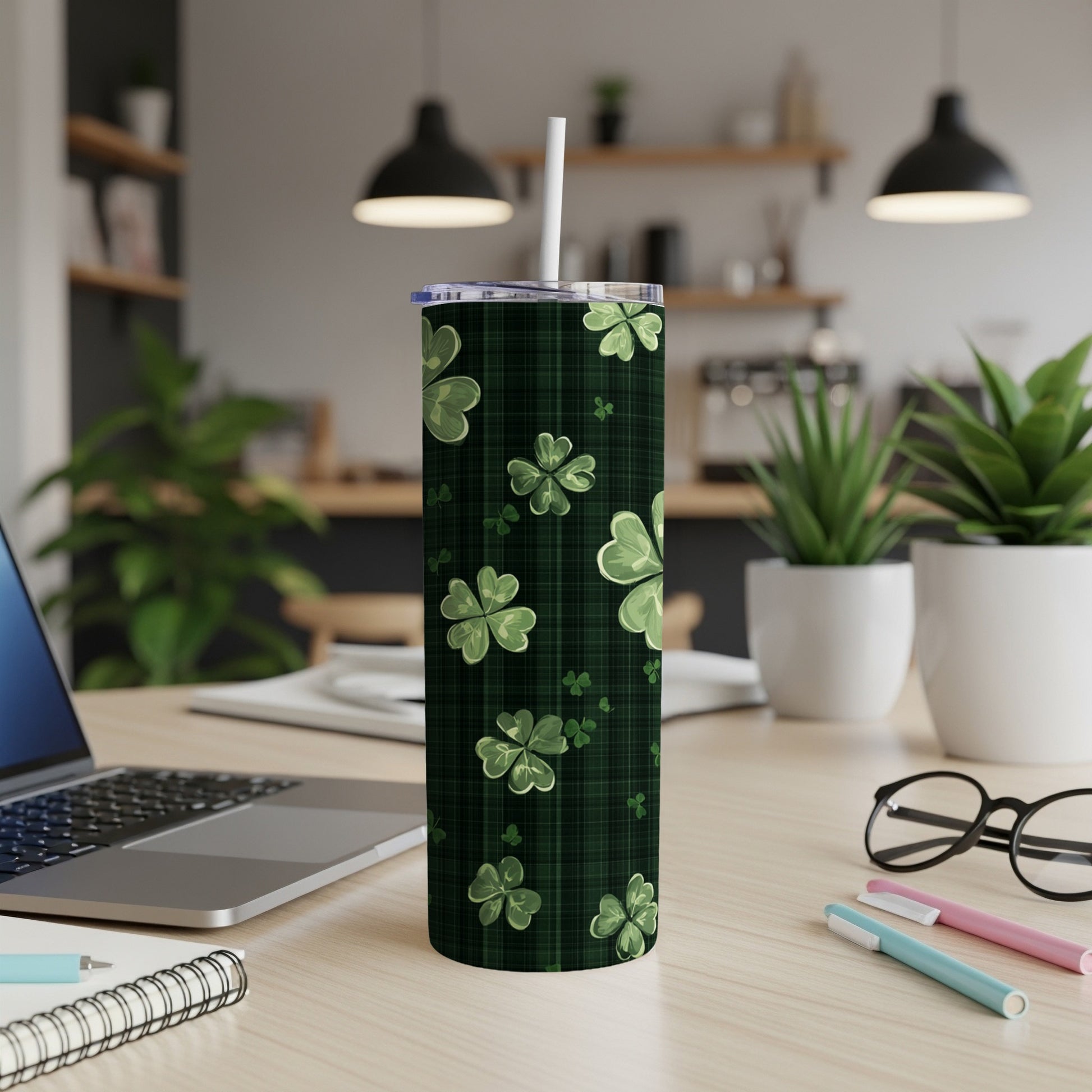 Green plaid tumbler with shamrock pattern and white straw.