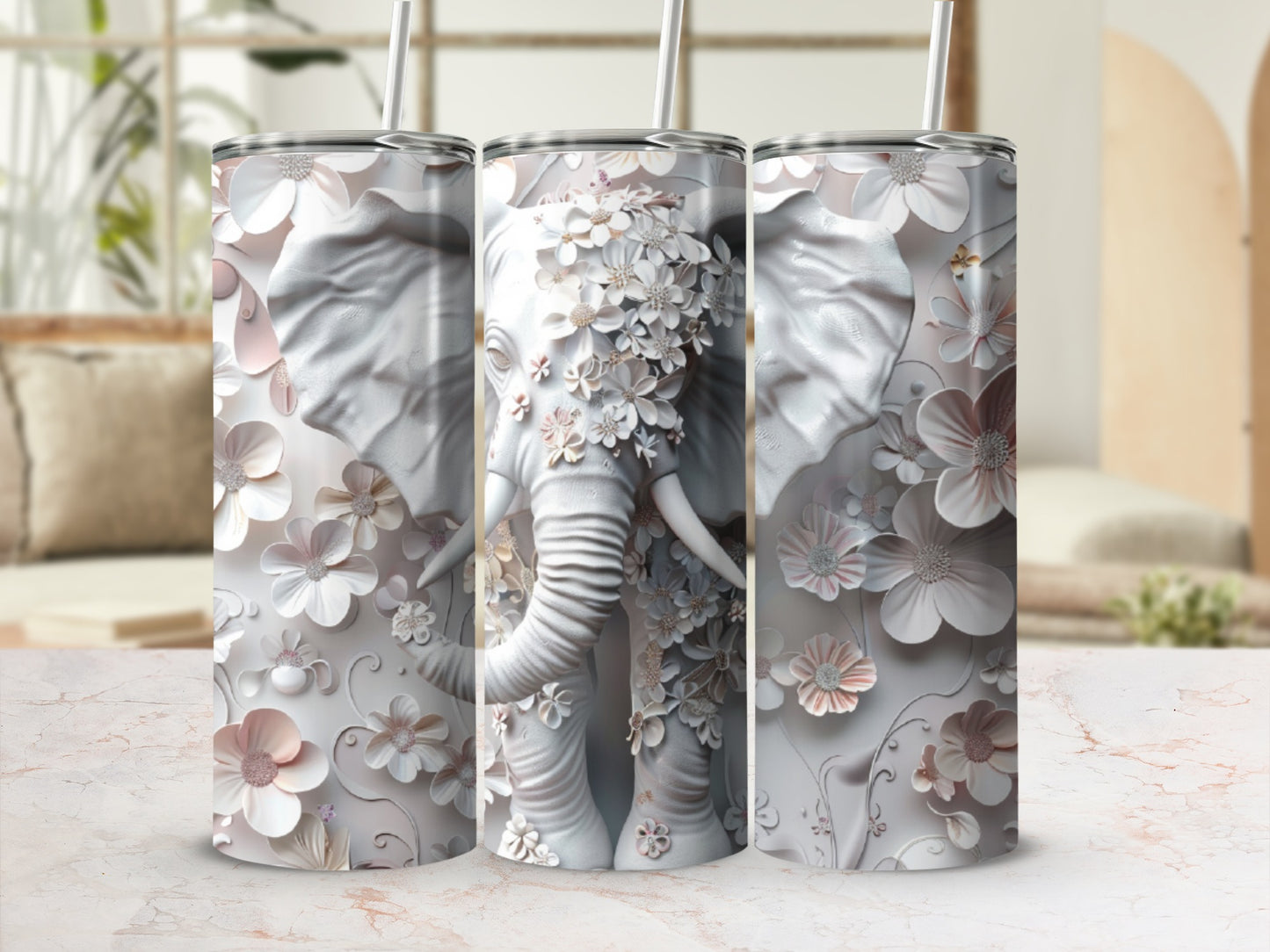 White embossed elephant with floral accents on a tumbler.