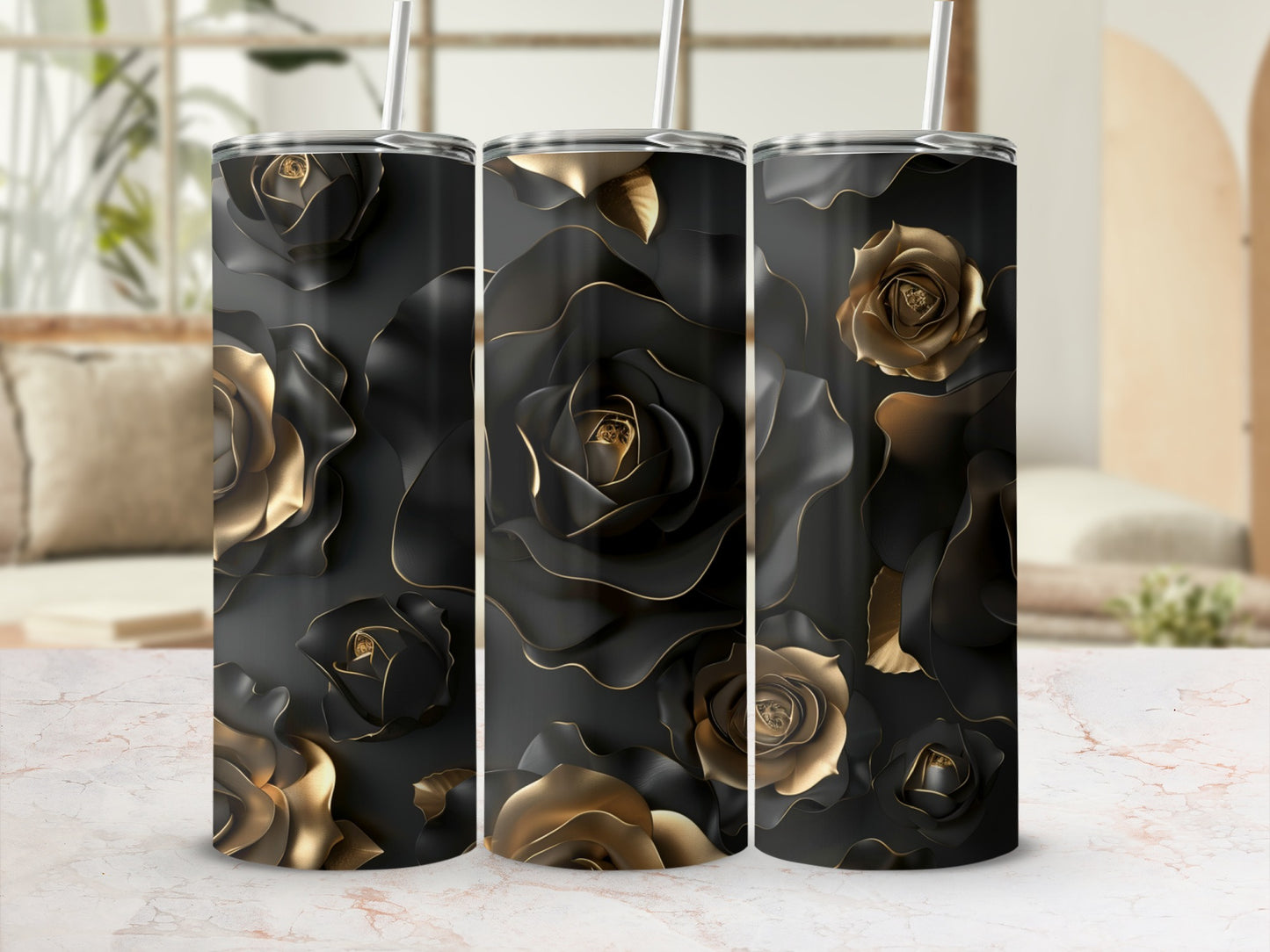 Three black tumblers with embossed gold roses and straws, on a marble surface.