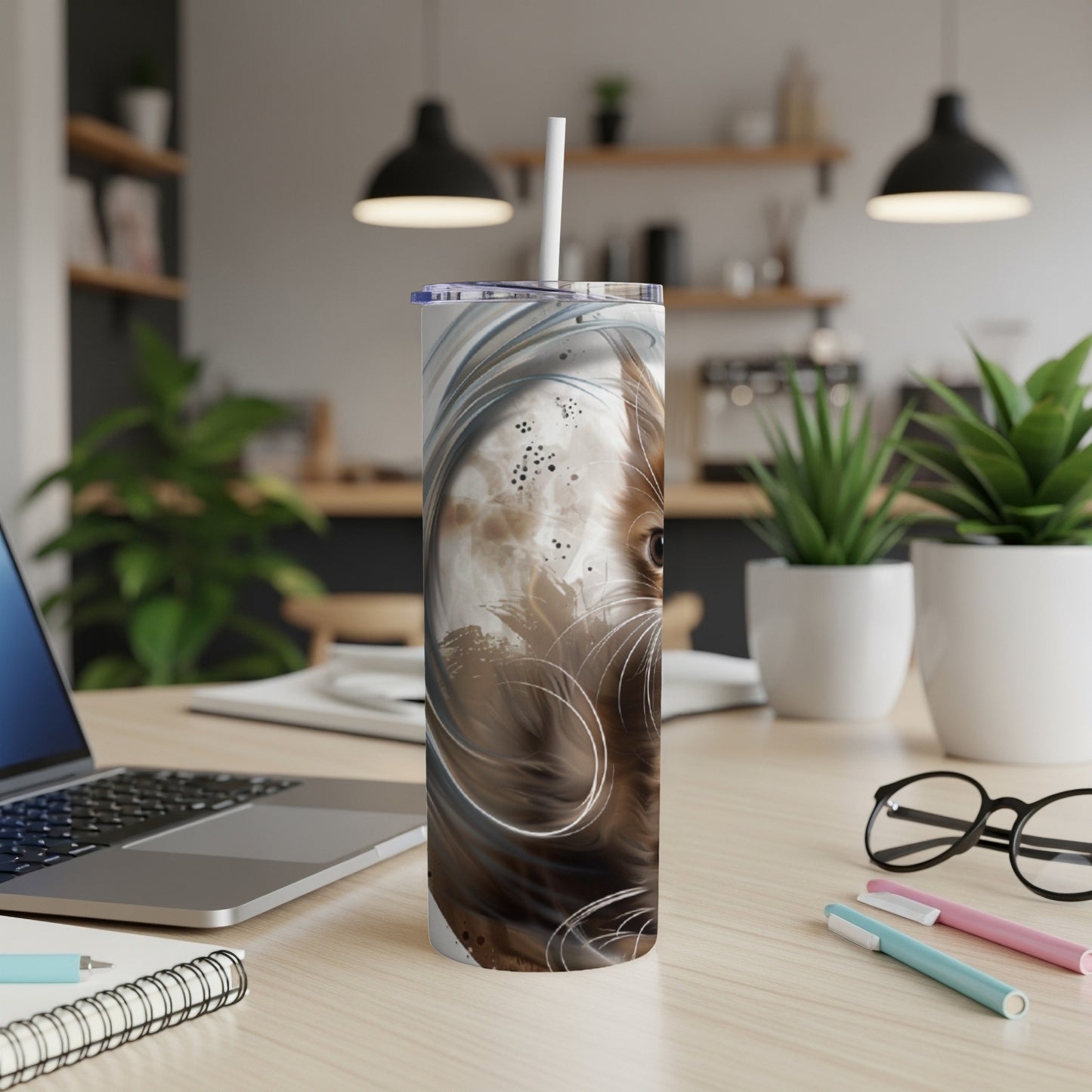 Brown and white swirl pattern on a tall tumbler with a straw.