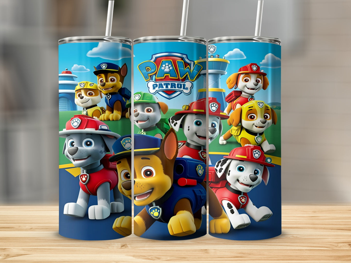 Paw Patrol characters on a blue tumbler with white straws.