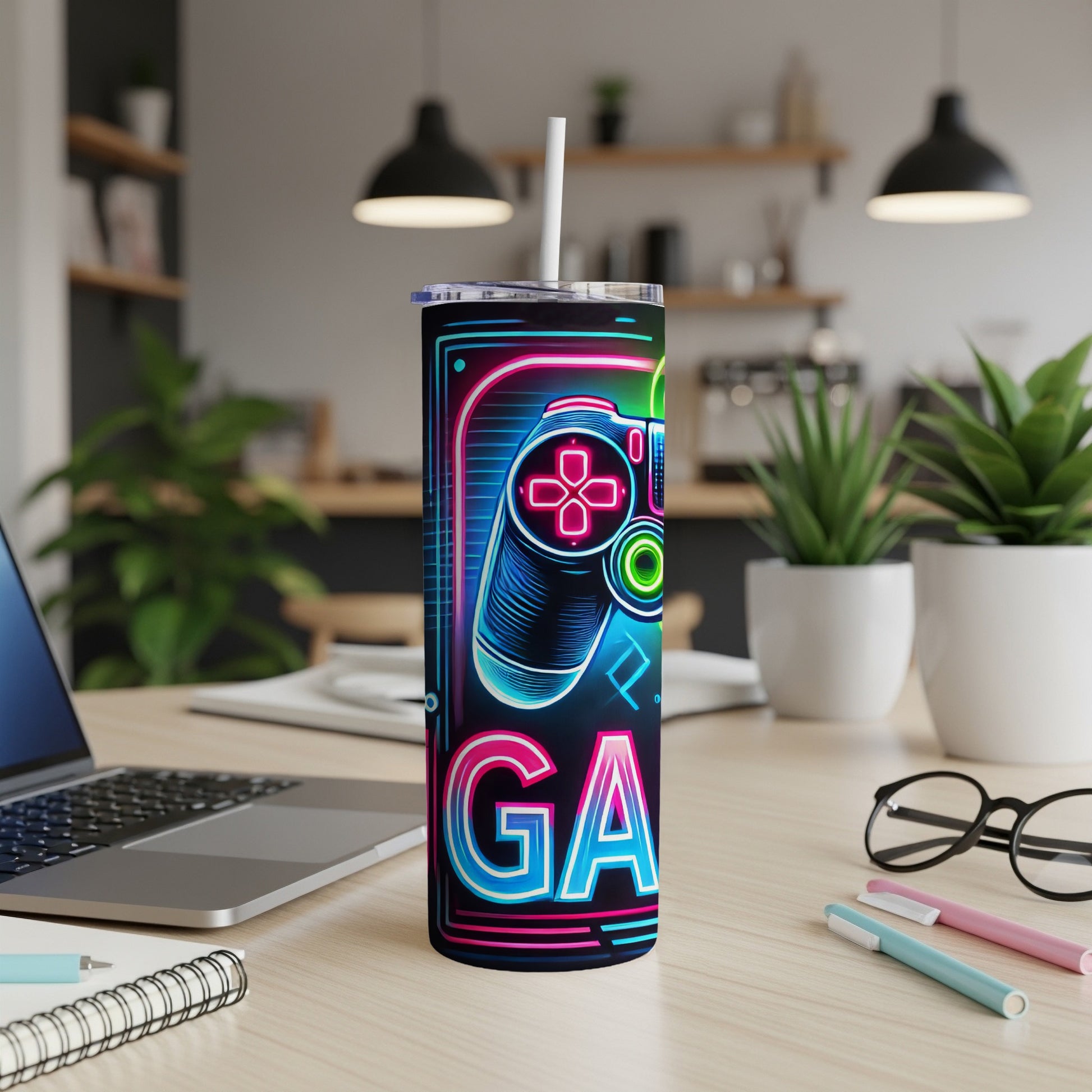 Neon gamepad and "GA" text on a black tumbler with a white straw.