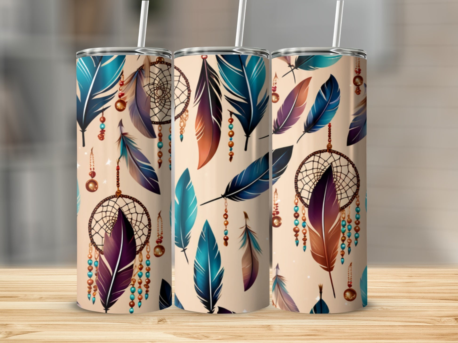 Three tumblers with feathers and dreamcatcher designs.