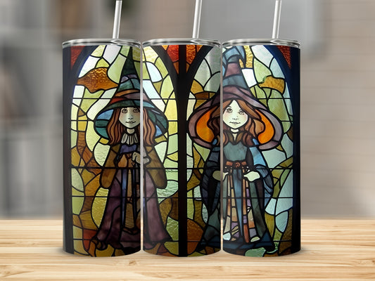 Three tumblers with stained glass witch designs and straws.