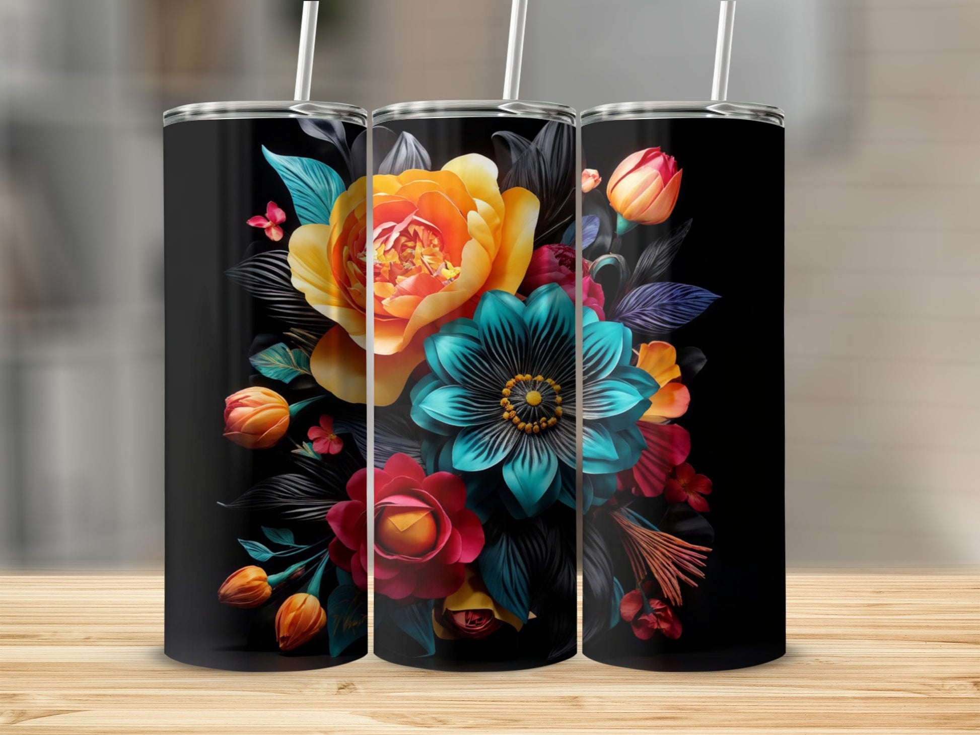 Black tumblers with vibrant floral designs featuring roses and teal flowers.