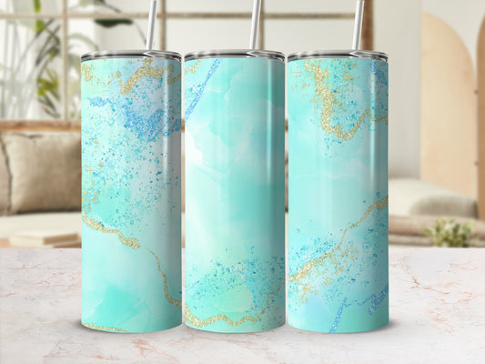 Three teal and gold marble pattern tumblers with straws.