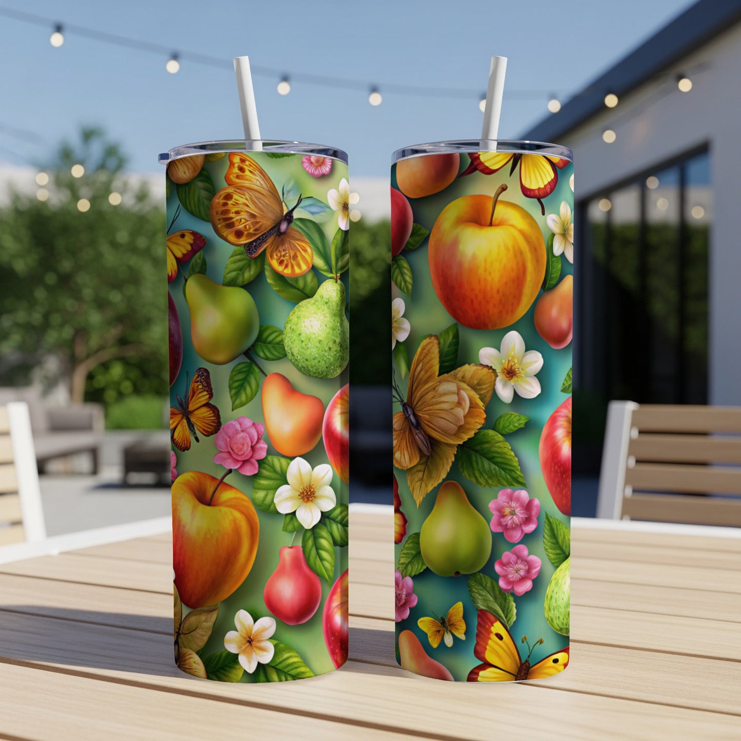 Two tumblers with colorful fruit, butterfly, and flower pattern.